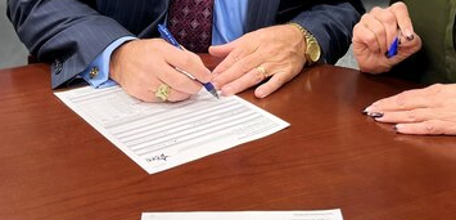 Individuals signed a Government Document Individuals signed a Government Document