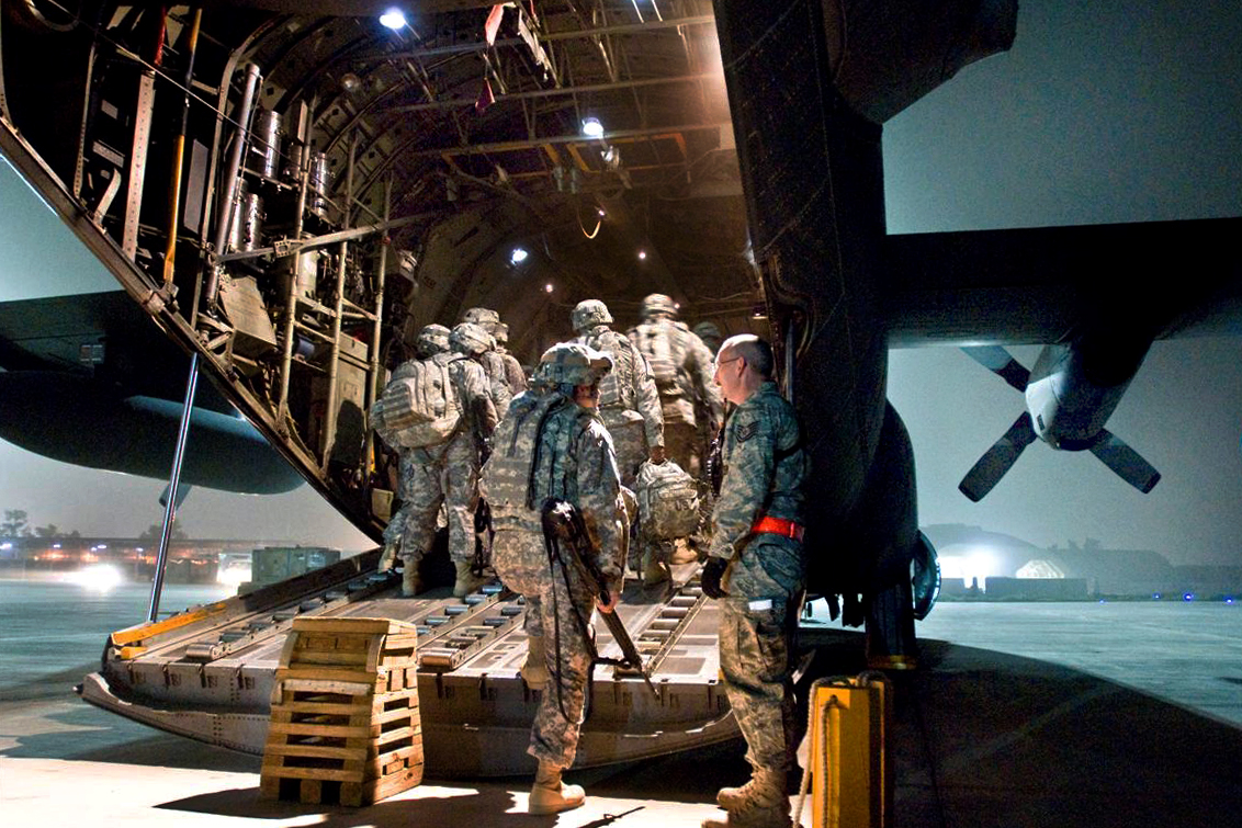 soldiers entering aircraft