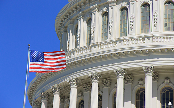 A U.S. flag flying over the Capitol