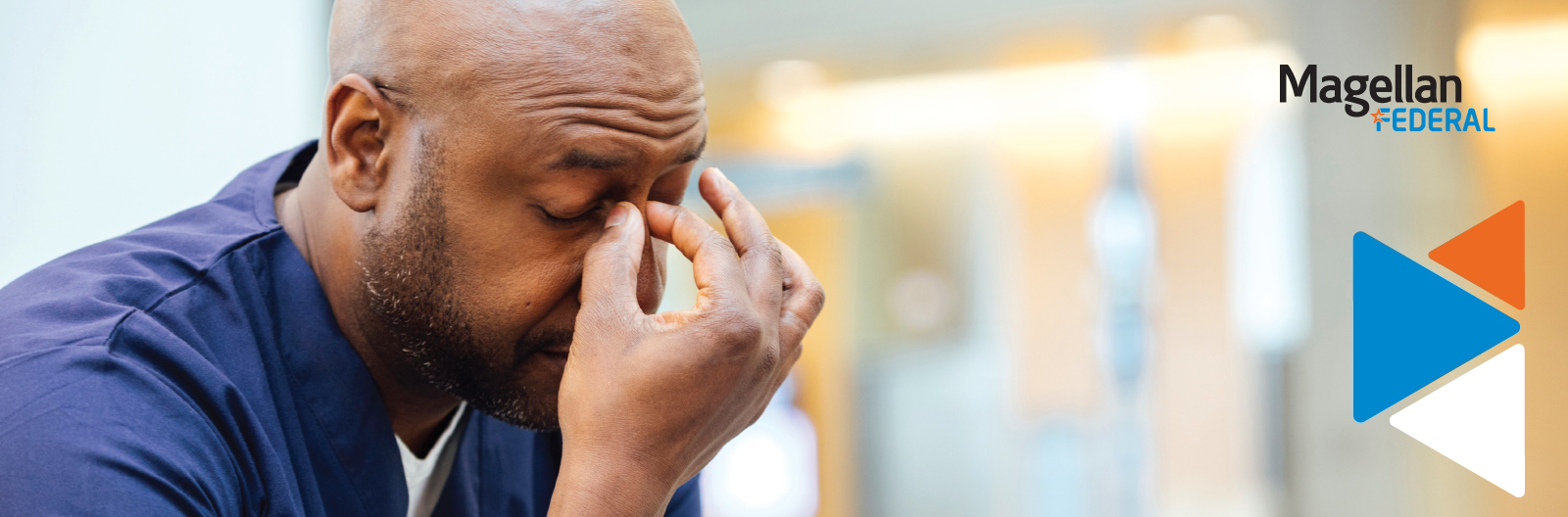 A man holding his hand to his head in frustration.