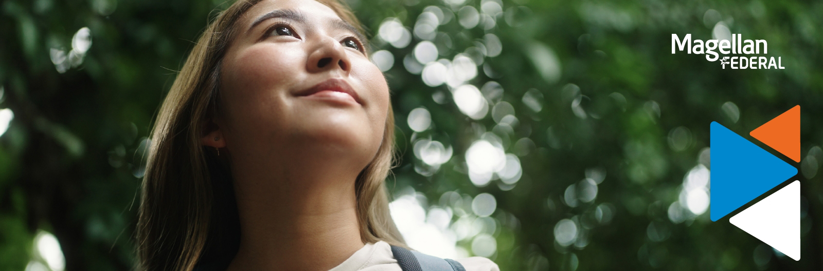 Woman staring up into the sky at peace.