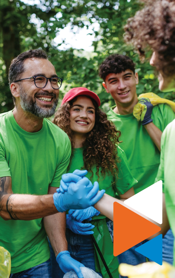 Family wearing green shirts working in the community.