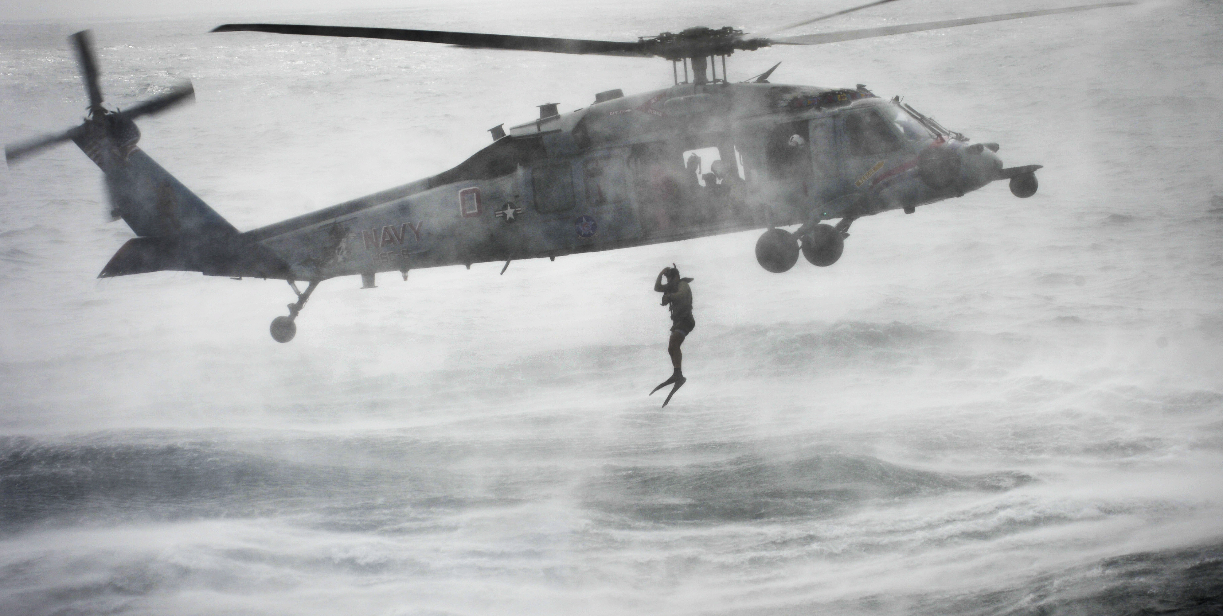 Diver jumping from helicopter