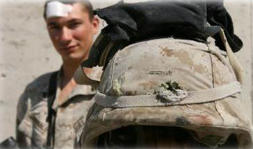 Marine stands with helmet