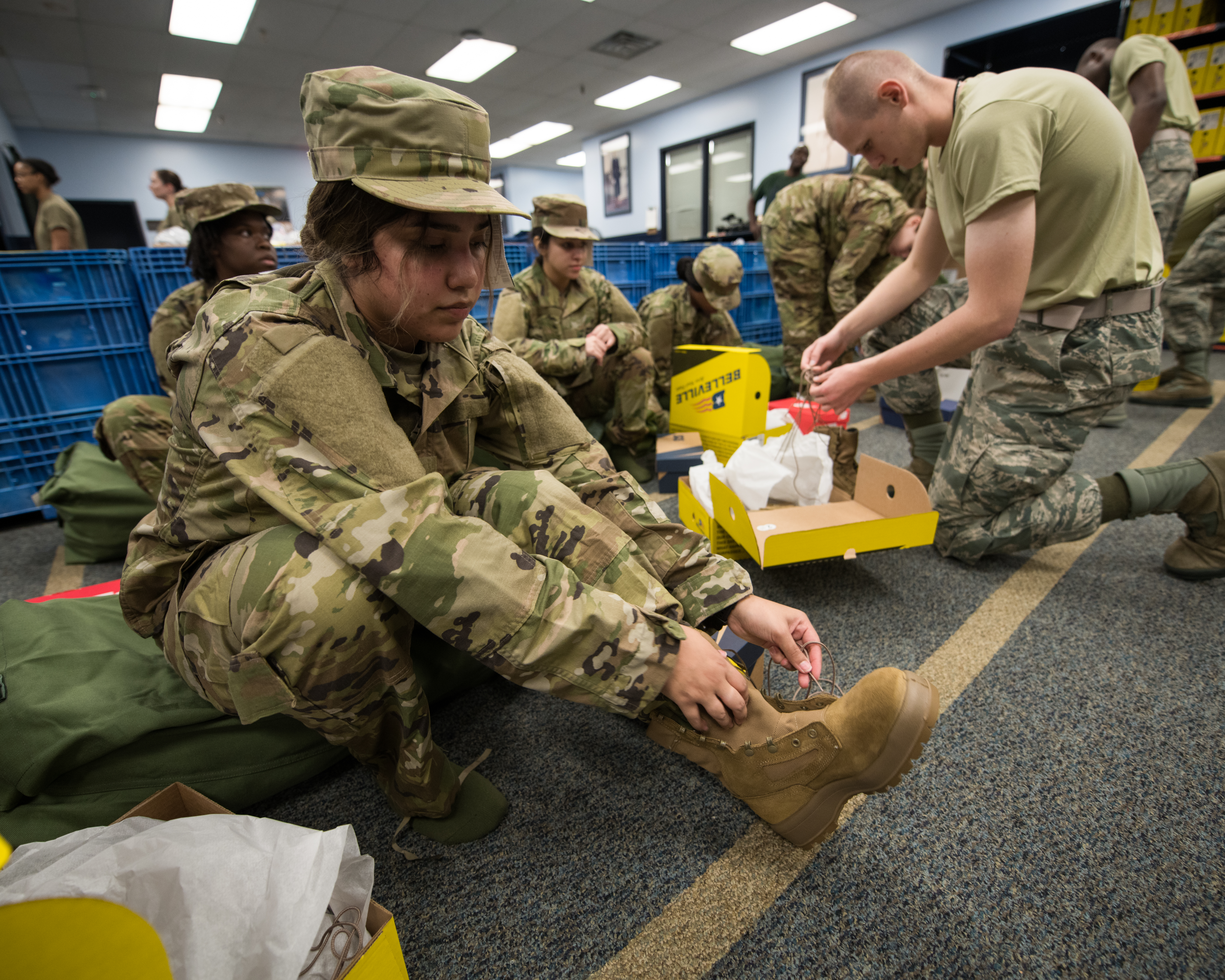 Soldiers putting on boots