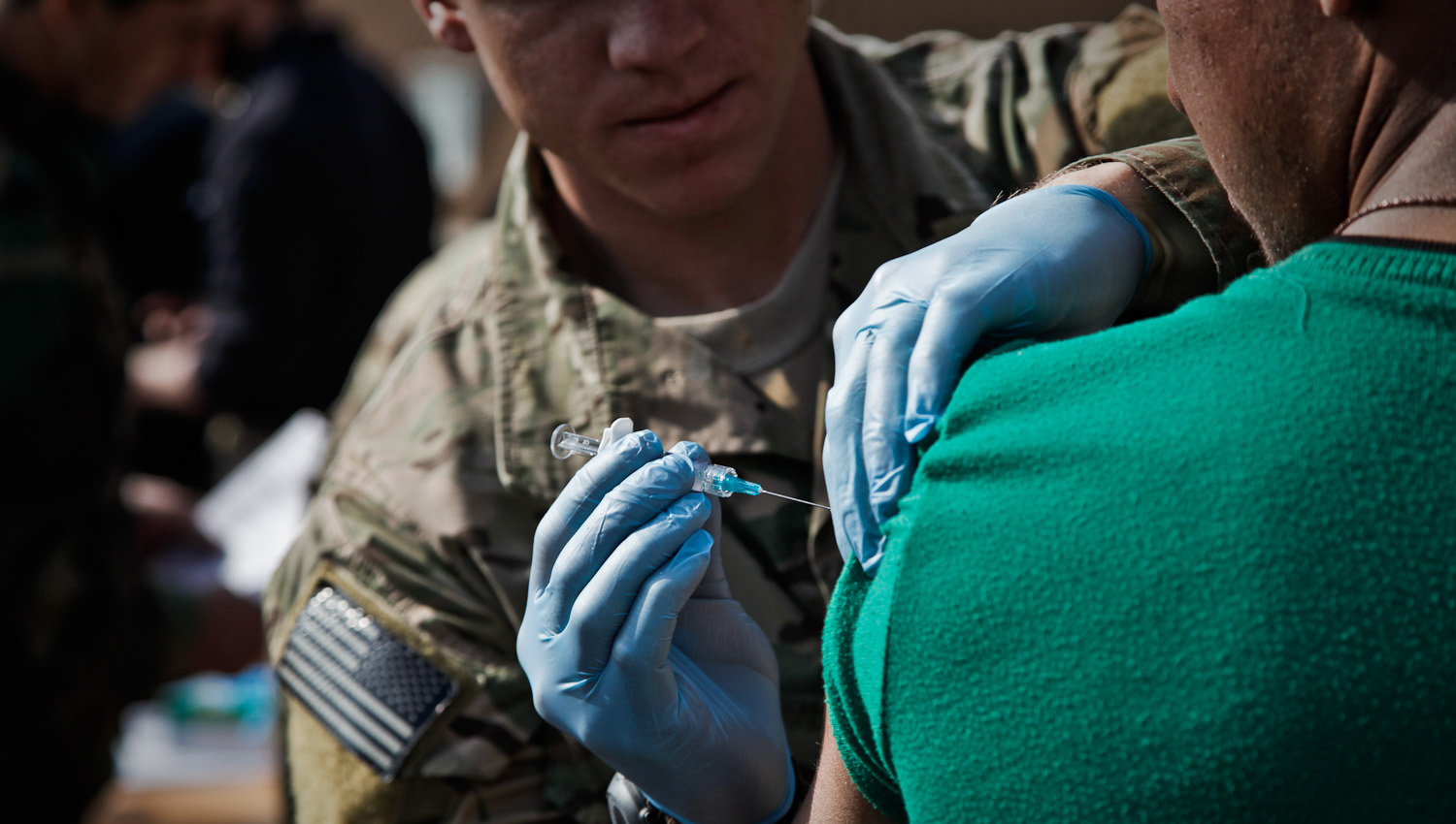 Employee giving a vaccine